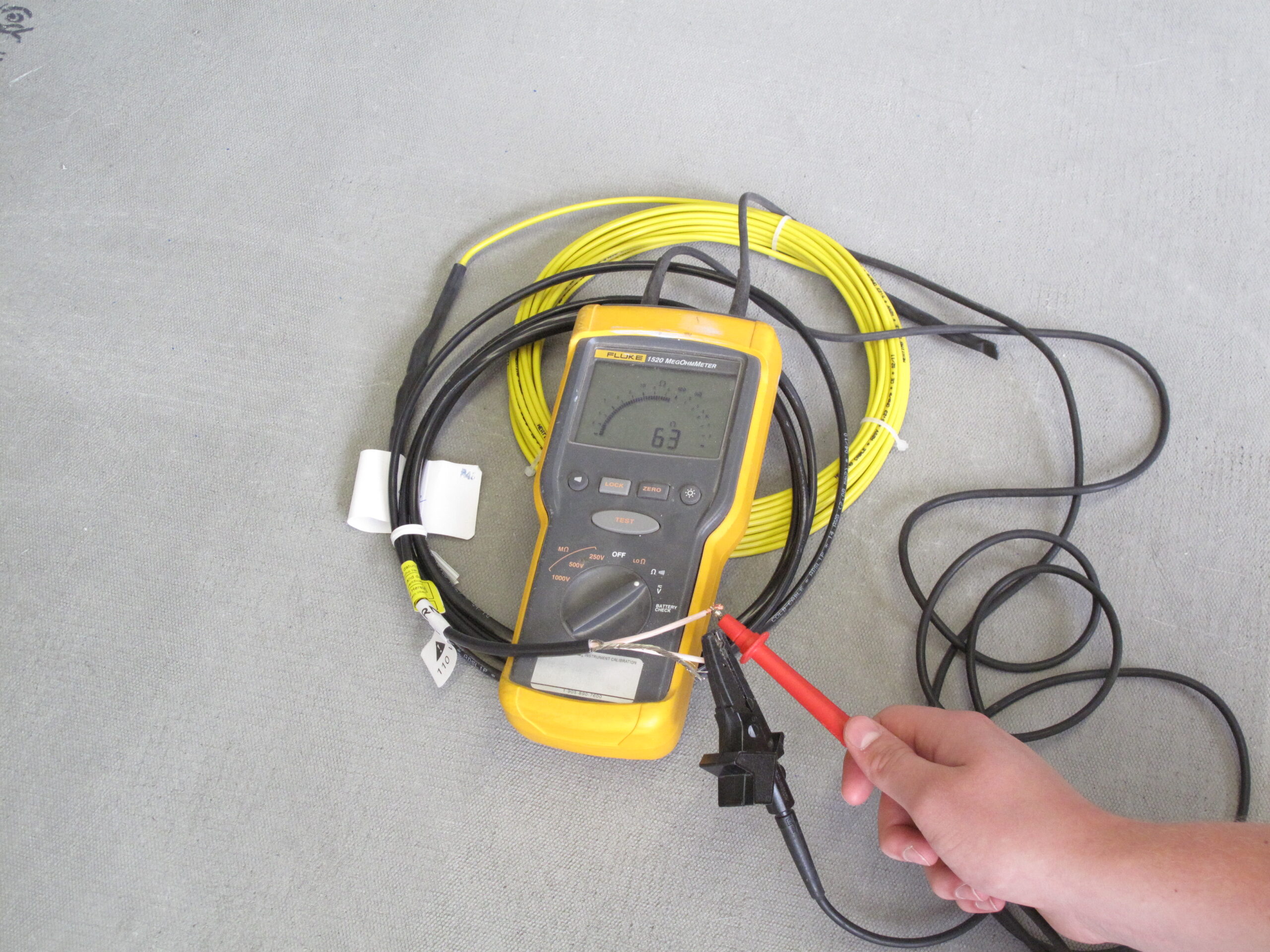 Digital ohm meter measuring resistance before installation