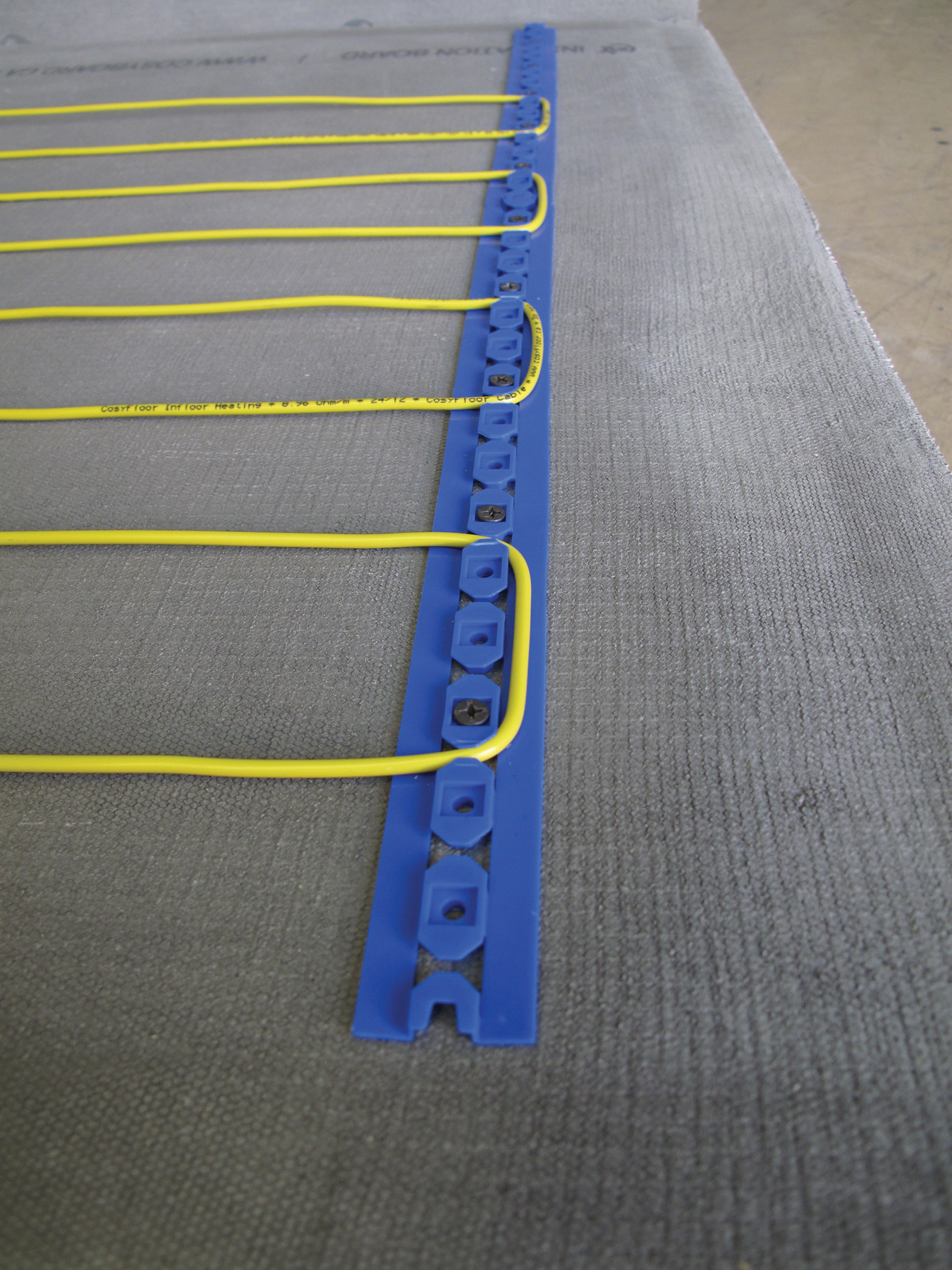 CosyFloor fixing strip installed holding the heating cable